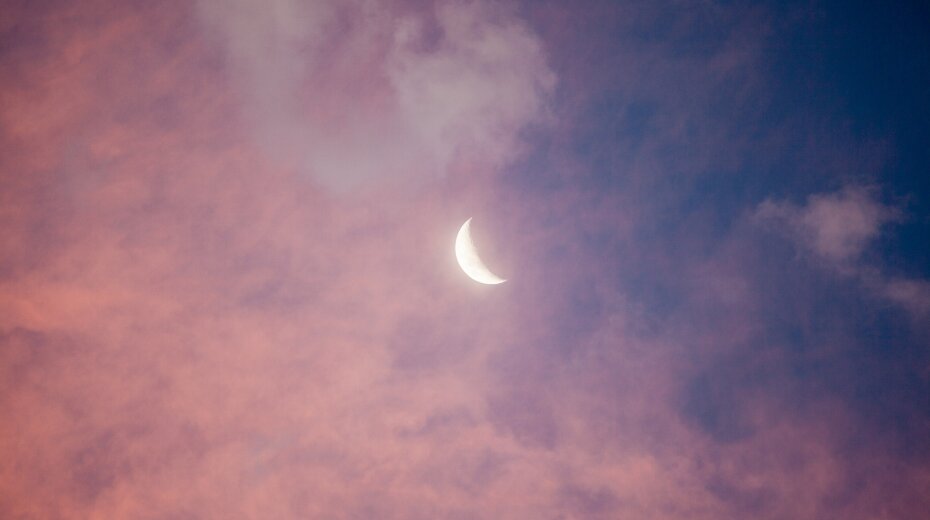 Crescent moon in a pink and blue sky, symbolizing tranquility and introspection; ideal for meditation and Kundalini yoga