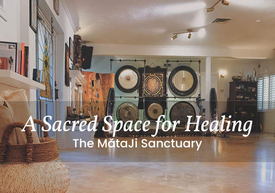 Spacious yoga studio with gongs, candles, and meditation cushions, labeled A Sacred Space for Healing: The MataJi Sanctuary.