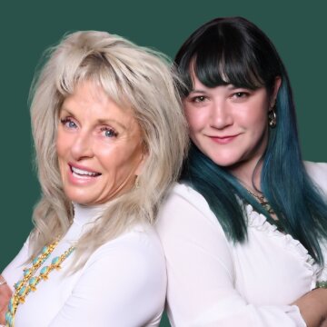 Two women smiling, one with long blonde hair and the other with teal-highlighted dark hair, against a green background.